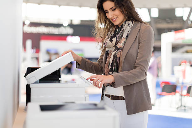 Document Preparation & Typing smiling woman making copies in office